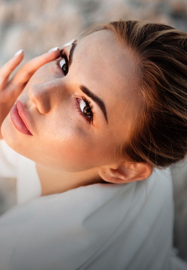Close-up of a woman with striking features.